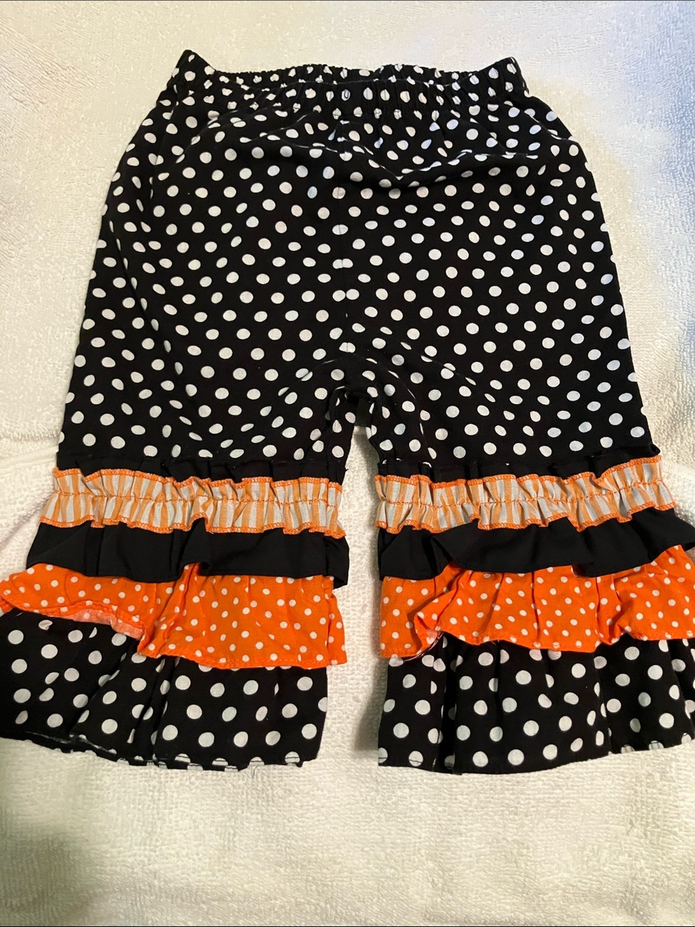 Girls Black Polka Dot Capri Pants with Orange Ruffle Tiers